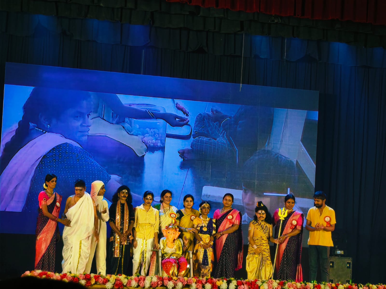 Staff and volunteers performing a cultural dance-drama depicting Lord Ganesha and mythological characters
